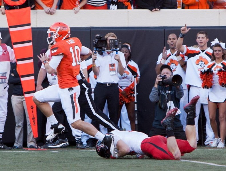 Nov 17 2012 Stillwater OK USA Oklahoma State Cowboys quarterback Clint Chelf 10 runs for yardage during the second quarter against the Texas Tech Red Raiders at Boone Pickens Stadium. Mandatory Credit Richard Rowe US PRESSWIRE Nov 17 2012 Stillwater OK USA Oklahoma State Cowboys quarterback Clint Chelf 10 runs for yardage during the second quarter against the Texas Tech Red Raiders at Boone Pickens Stadium. Mandatory Credit Richard Rowe US PRESSWIRE